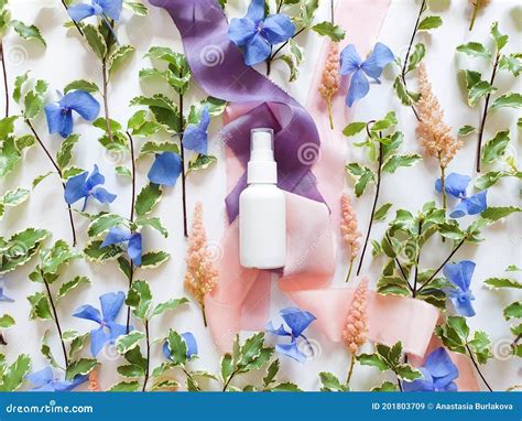 Mockup Of Unbranded White Plastic Spray Bottle Blue And Pink Flowers