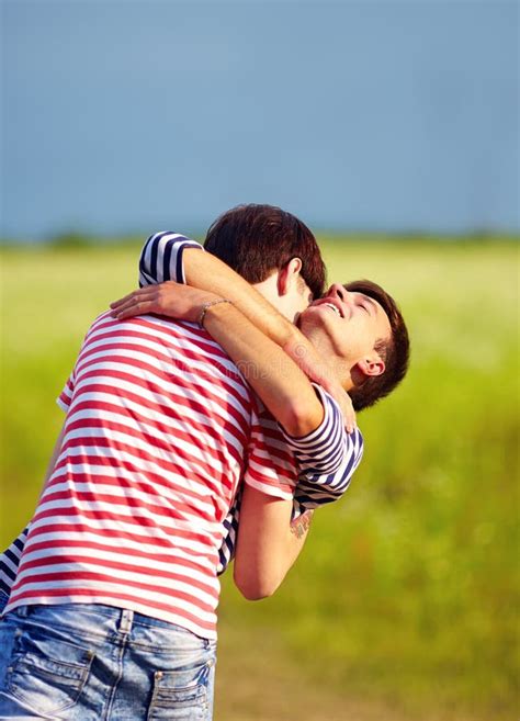 Young Male Couple Embracing Outdoors Stock Image Image Of Meadow Community 66222177