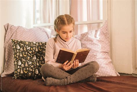 Little Girl Reading A Book By Stocksy Contributor Aleksandra