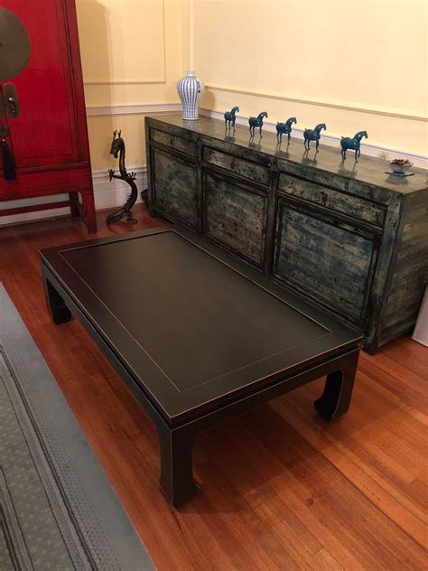 Fine quality late 20th century square mosaic coffee table featuring an intricately detailed tiger made of multicolored ceramic tiles. Baoshi Black Tiger Feet Coffee Table - NookDeco