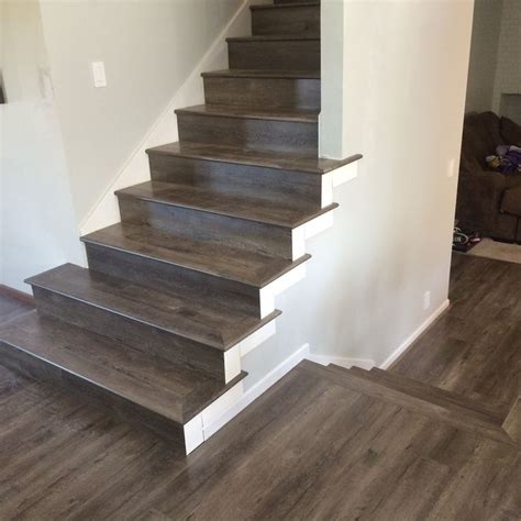 He should put temporary spacers at the start, because pushing on the boards while installing may shift the position and angle relative to the first wall. Tap & Go Laminate flooring full stairs treads. | Laminate ...
