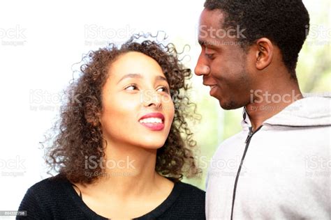 Young Mixed Race Couple Working In An Enginering Workshop Stock Photo