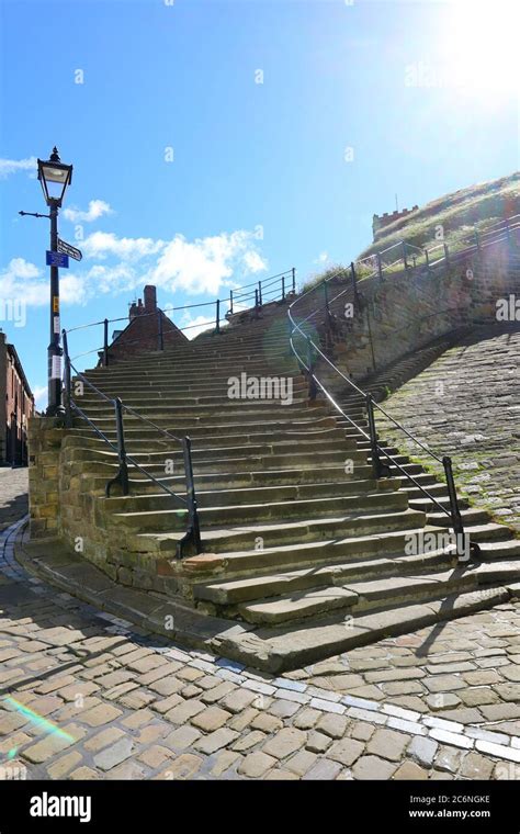 The Famous 199 Steps To Whitby Abbey With Blue Sky Background North