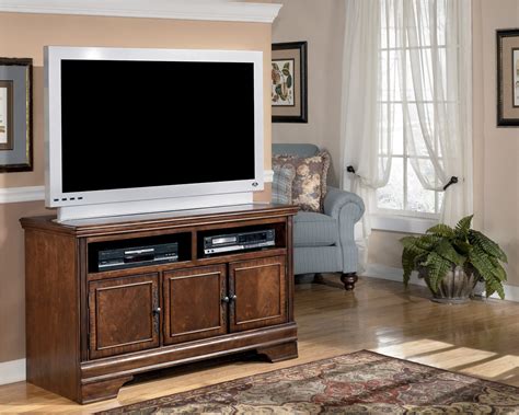 The smart design also adds two shelves with a unique ability to swivel, so your tv can be directed up to 15 degrees in all directions by pivoting the mounting section. Hamlyn 50 Inch TV Stand from Ashley (W527-28) | Coleman ...
