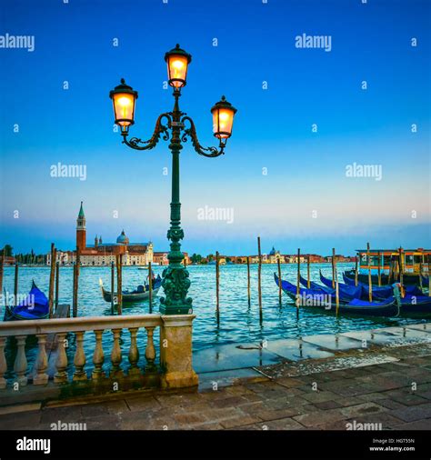 Venice Street Lamp And Gondolas Or Gondole On A Blue Sunset Twilight