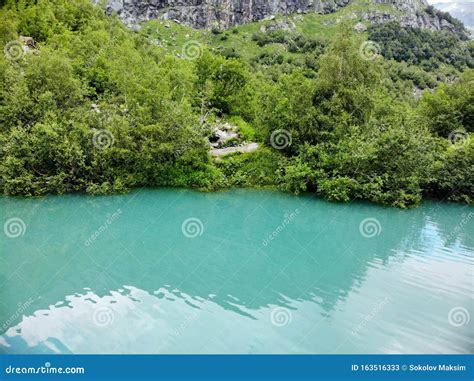 An Aerial View Of The Beautiful Mountain Lake With Turquoise Water