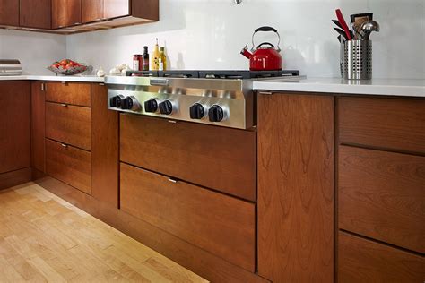 Perhaps dual trash cans, with a garbage can and a recylce bin or a small trash can for just your food scraps, or a motion sensor trash can is ideal. Upper Cabinet Finger Pulls | Bruin Blog