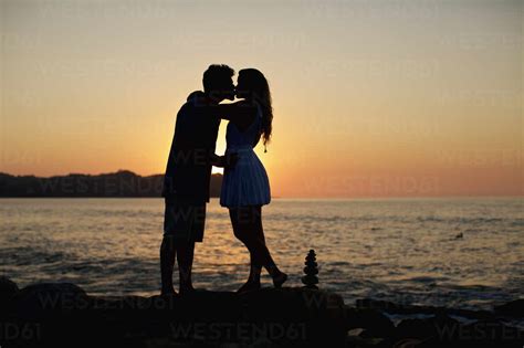 Kissing Couple Silhouette Sunset