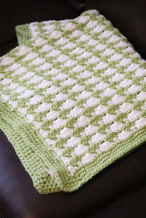 Use this color palette (which is perfect for little boys), or change it up to match the babys room. Shell Stitch Blanket | AllFreeCrochet.com