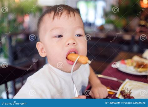 Toddler Baby Boy Child Biting And Eating Sausages Stock Image Image Of