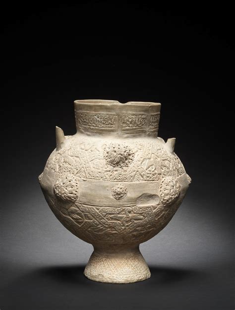 bonhams a large unglazed moulded pottery jar persia 12th 13th century