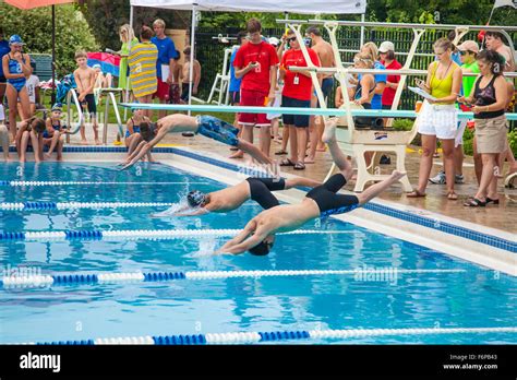 Boys Age 12 Diving Into Pool Water Participating In Swim Meet St Paul