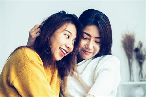 Beautiful Young Asian Women Lgbt Lesbian Happy Couple Sitting On Bed Hugging And Smiling