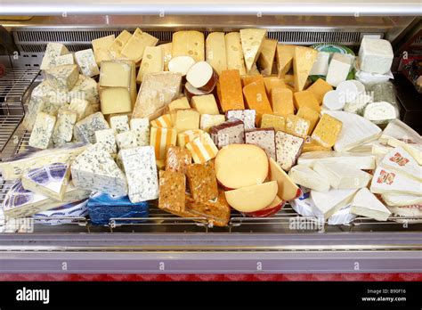 Cheese Display On Supermarket Counter Stock Photo Royalty Free Image