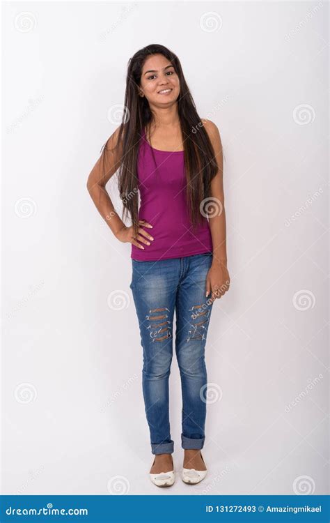 Full Body Shot Of Young Happy Indian Woman Smiling While Standin Stock