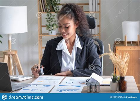 African American Businesswoman Working In The Office Using Laptops