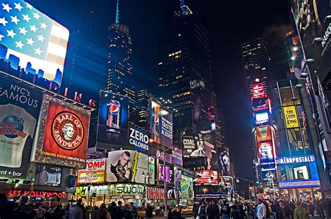 Broadway theatre and rockefeller center are notable landmarks, and the area's natural beauty can be seen at bryant park and central park. Times Square New York City By Night 3 Photograph by ...
