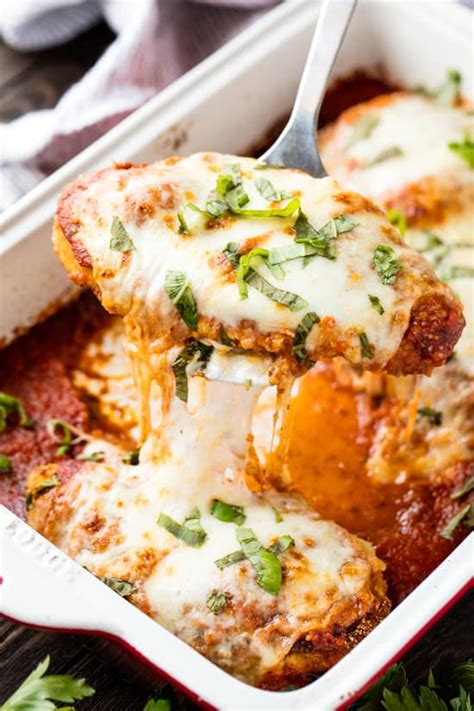Easy, delicious and healthier this baked chicken parmesan recipe, made with breaded chicken thighs for extra juiciness so moist and utterly flavorful especially with the cheese and the tomato juice addition. Best Chicken Parmesan Recipe - thestayathomechef.com