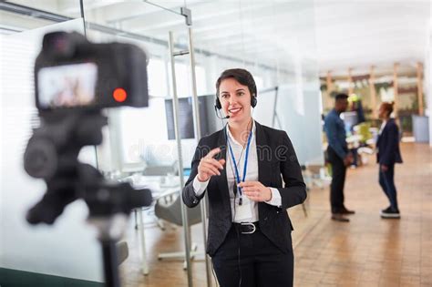 Business Woman As A Live Reporter In Front Of The Video Camera Stock