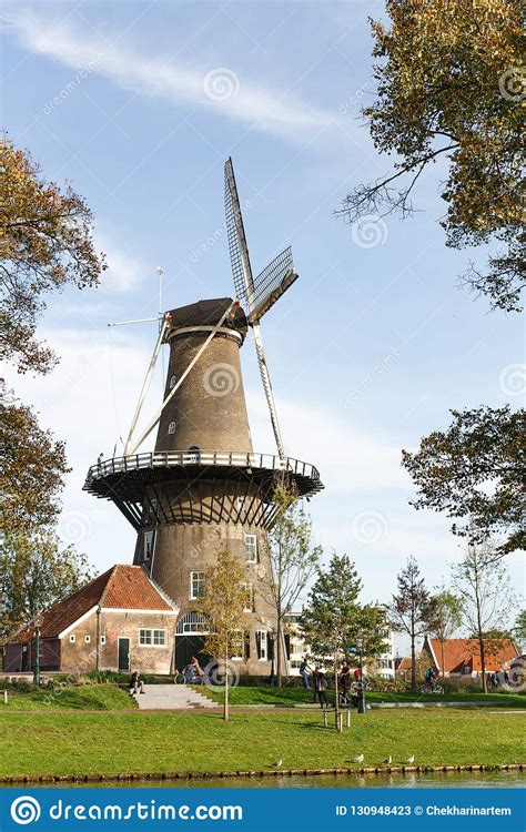 Molen De Valk Windmill At Leiden Netherlands Sunny Day And Sky With Clouds Stock Image
