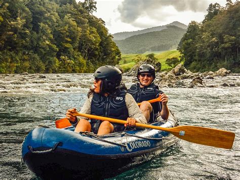 Couple Kayaking A River In New Zealand Kayak New Zealand