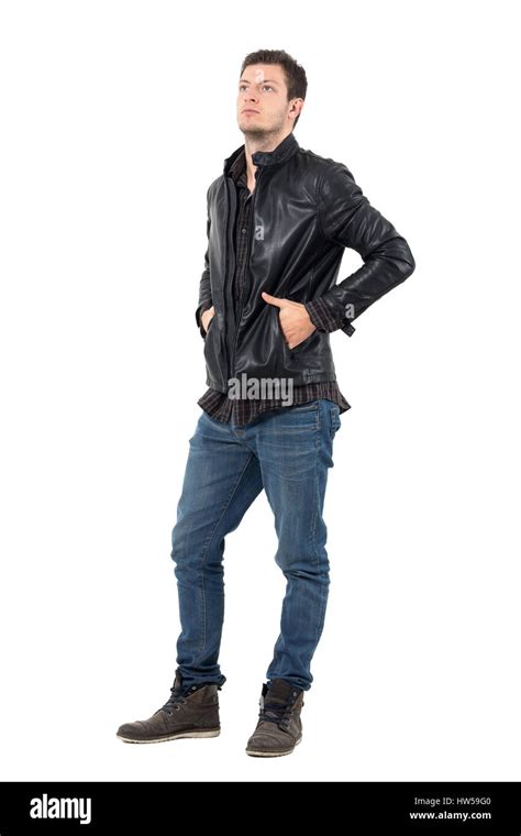 Young Serious Casual Man In Leather Jacket With Hands In Pockets