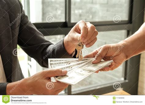 Home Business Concepts,Buyers And Sellers Give Dollar Money,Sellers Give Keys. Stock Photo 