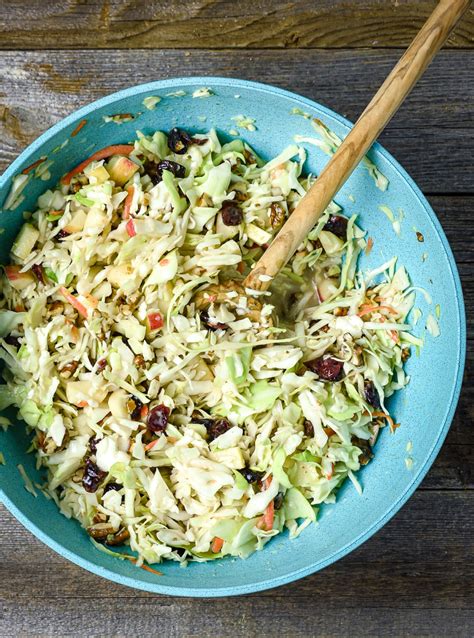 Prepare the dressing by combining the mayonnaise, sour cream, vinegar, honey, lemon juice and some salt and pepper in a large mixing bowl. Apple Cranberry Coleslaw (No Mayo, Vegan) - Shane & Simple