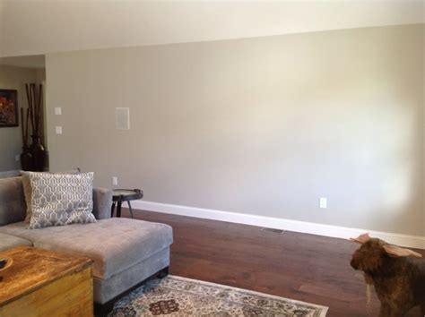 Hang a large painting to quickly and easily decorate a large wall. Need help with decorating long wall area in Living Room