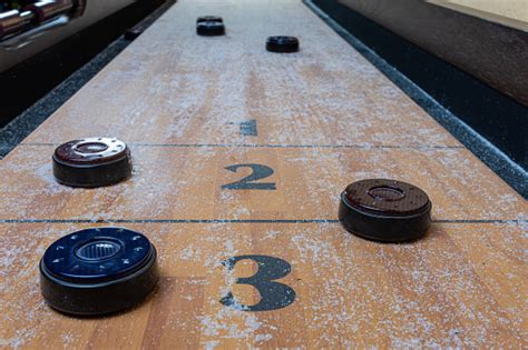 Tabletop Shuffleboard Game With Pucks And Salt Stock Photo Download