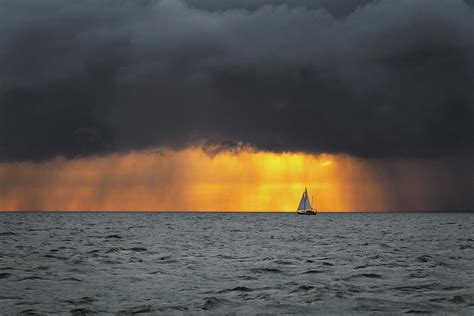 Boat Sailing Into The Storm At Sunrise Photograph By Arsen Volkov