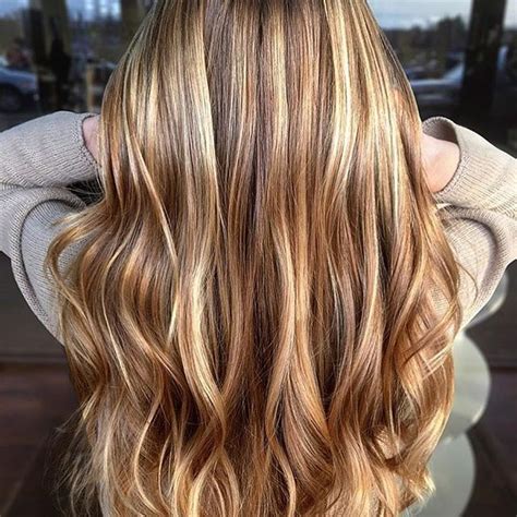 This haircut will flatters most skin tones and hair types. Caramel highlights | Long hair styles, Honey hair