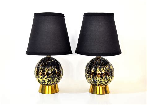Free shipping on orders over $35. SELECT MODERN: Pair of Hollywood Regency Black and Gold ...
