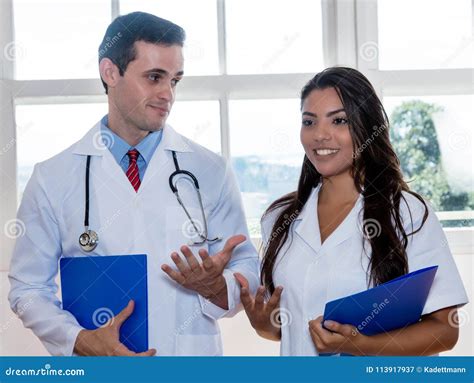 Handsome Doctor With Nurse Visiting Patients Stock Image Image Of