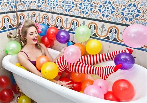 Blonde Woman With Sunglasses Playing In Her Bath Tube With Bright Colored Balloons Sensual Girl