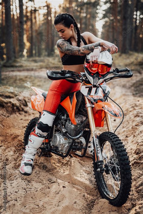 Beautiful Female Racer Wearing Motocross Outfit With Semi Naked Torso