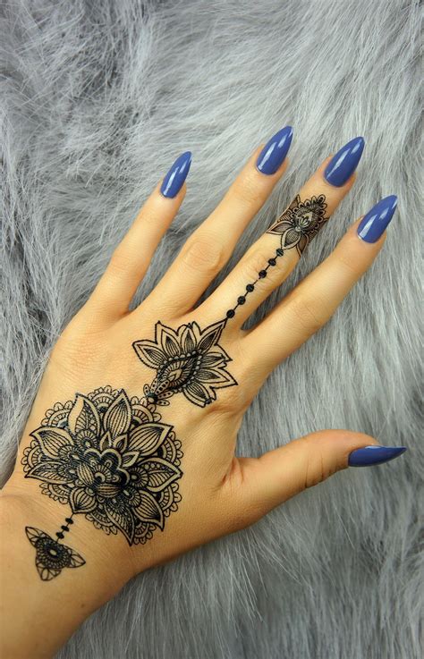 Henna tattoo, also known as mehndi, is a sort of temporary tattoo that is very common in south asian countries, as well as countries in the middle east. " Henna Style Lotus" - Black | Henna tattoo hand, Henna ...
