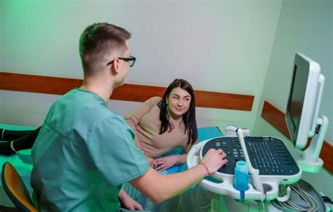 Premium Photo Doctor Conducting Ultrasound Examination Of Woman In