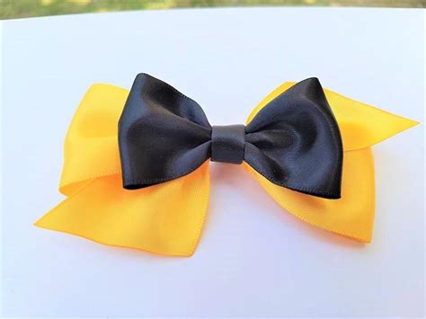 I couldn't find the two yellow bows as i was hoping for, but these are the yellow bows i have right now. 10-50 Bulk Emma Yellow Wiggles Bow School Costume Party ...