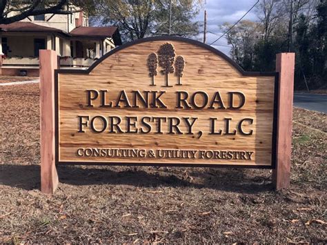 Cedar Carved Business Sign With Smooth Background The Carving Company