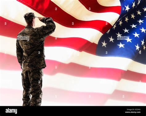 Army Soldier Saluting In Front Of American Flag Stock Photo Royalty