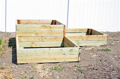 I built the frame out of 2x4s and then used cedar fences to make the box using braces from national hardware. Creative Mommas: DIY Tiered Raised Garden Beds
