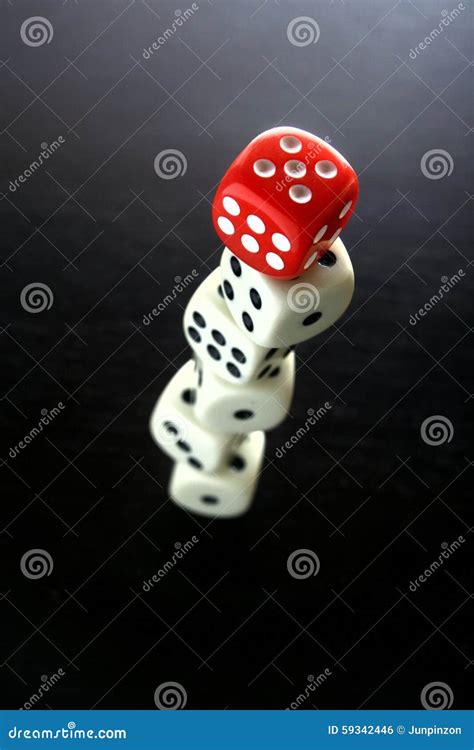 One Red Game Dice On Top Of Stacked Five White Game Dice Stock Photo