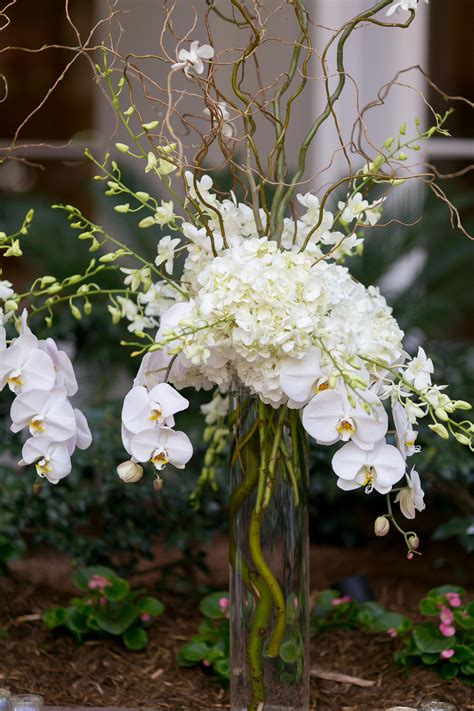 White Hydrangea And Cymbidium Orchid Centerpiece Orchids Orchid Centerpieces Orchid Wedding