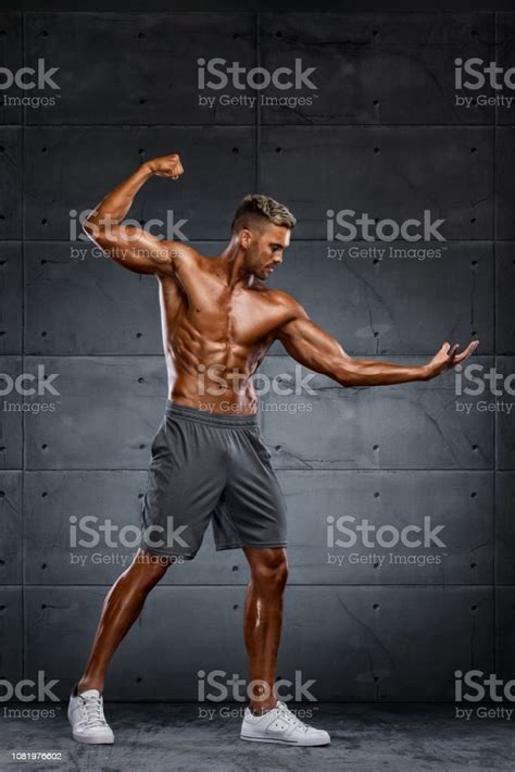 Muscular Men Flexing Muscles Stock Photo Download Image Now