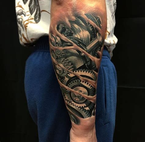 Realistic Mechanical Arm Tattoo With Cogs Done On Guy S Forearm By Vid