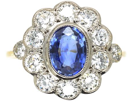 Art deco rings are one of the most popular antique engagement ring styles, and for a good reason. Art Deco 18ct White & Yellow Gold, Sapphire & Diamond Oval Cluster Ring - The Antique Jewellery ...