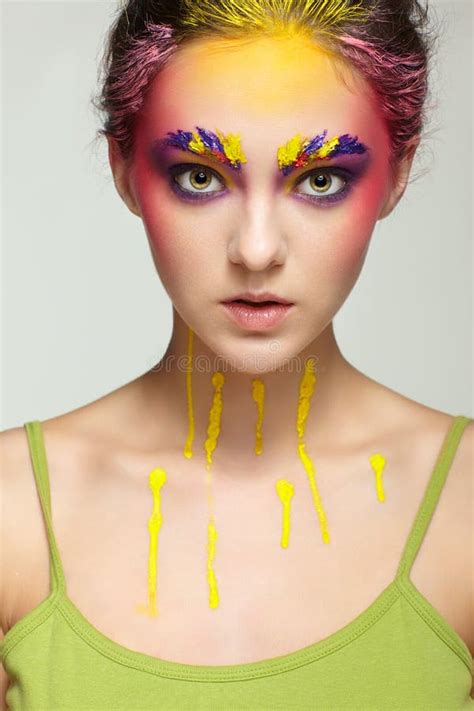 Female Portrait With Unusual Face Art Make Up Paint On Brows Hair