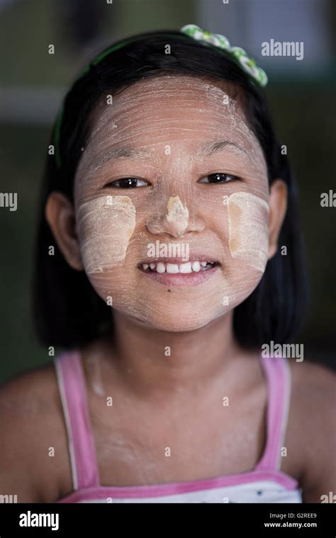 Portrait Of A Beautiful Burmese Girl Wearing Traditional Make Up