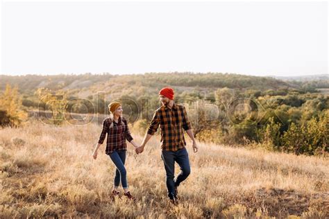 Cheerful Guy And Girl On A Walk In Stock Image Colourbox